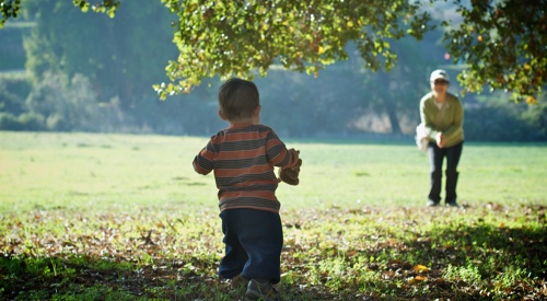 Child running in a field