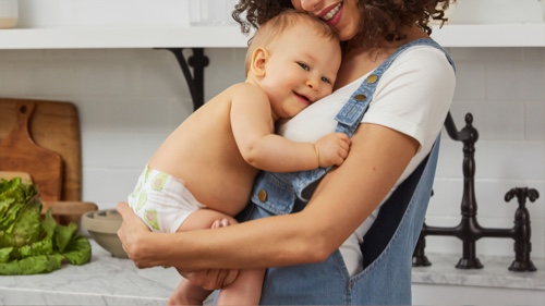 mother holding baby